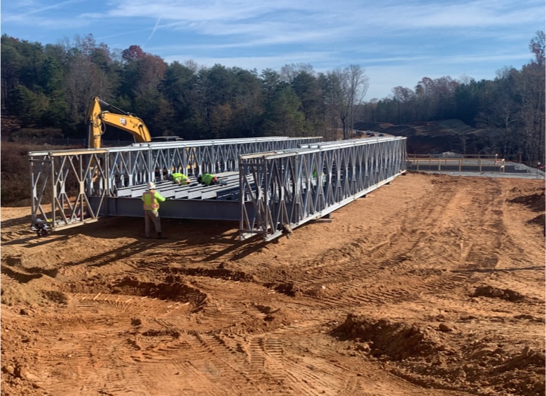 Construction of a bridge on a dirt road.